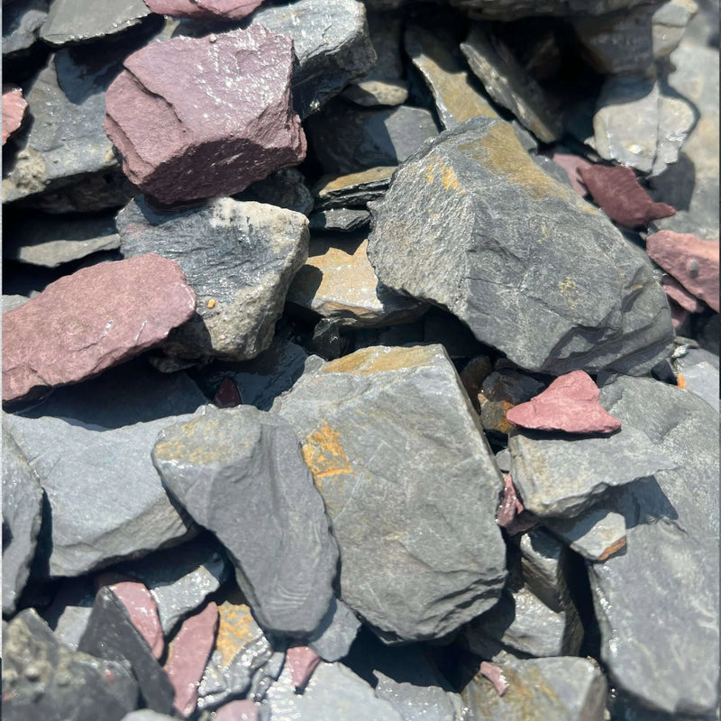 An image of Mixed Slate Chippings 40mm in size. Including Blue Slate, Purple Slate, Charcoal Slate and Green Slate Chippings.