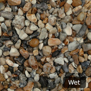 An image showing Oyster Pebble Stone Aggregate Chippings when they are wet.