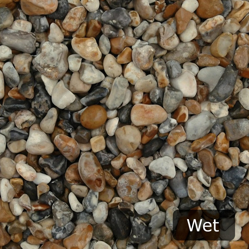 An image showing Oyster Pebble Stone Aggregate Chippings when they are wet.