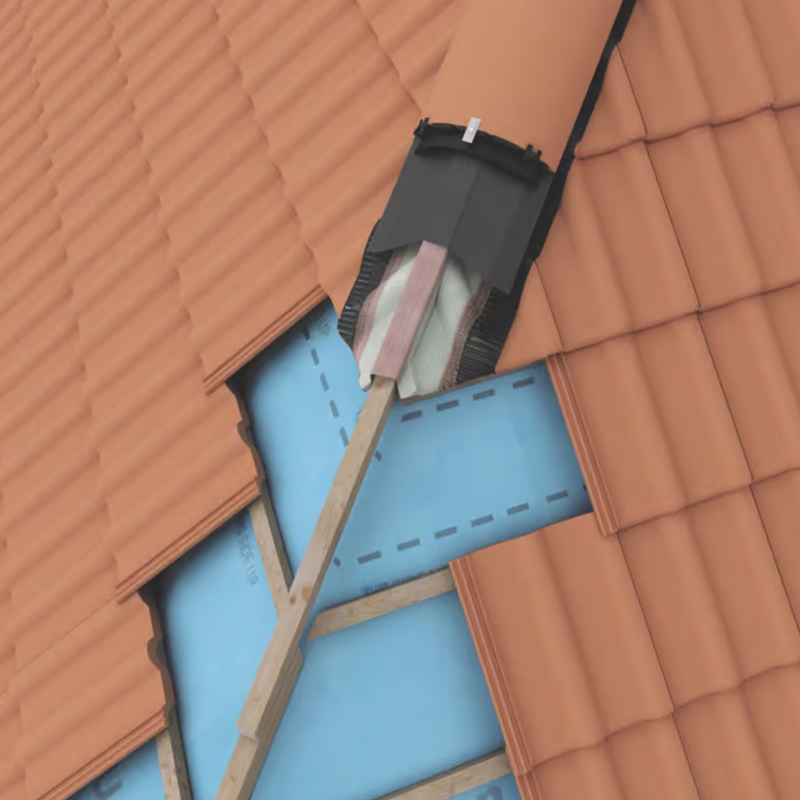 An image showing a PVC Hips Support Tray on the ridge of a roof and where it is fitted under a half round ridge tile.