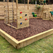 Image of Children's Play bard wood chippings.  They are brown tones and the image shows them laid out in a playground to show the effect