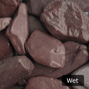 An aggregate image of Plum Slate paddle stones when wet