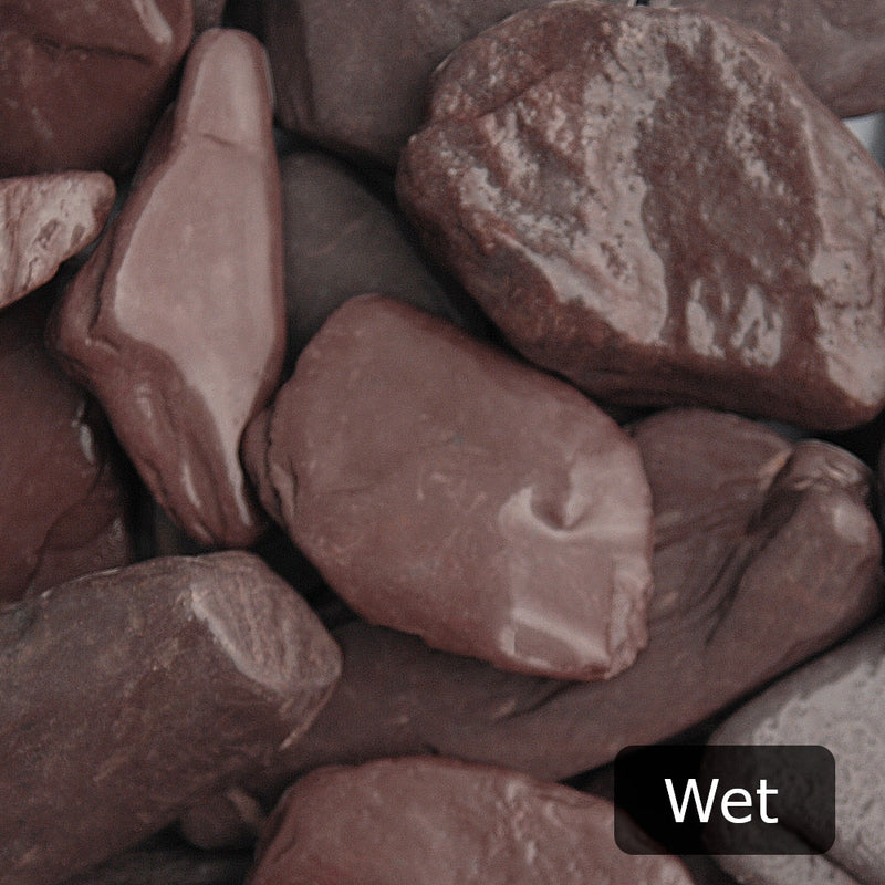 An aggregate image of Plum Slate paddle stones when wet