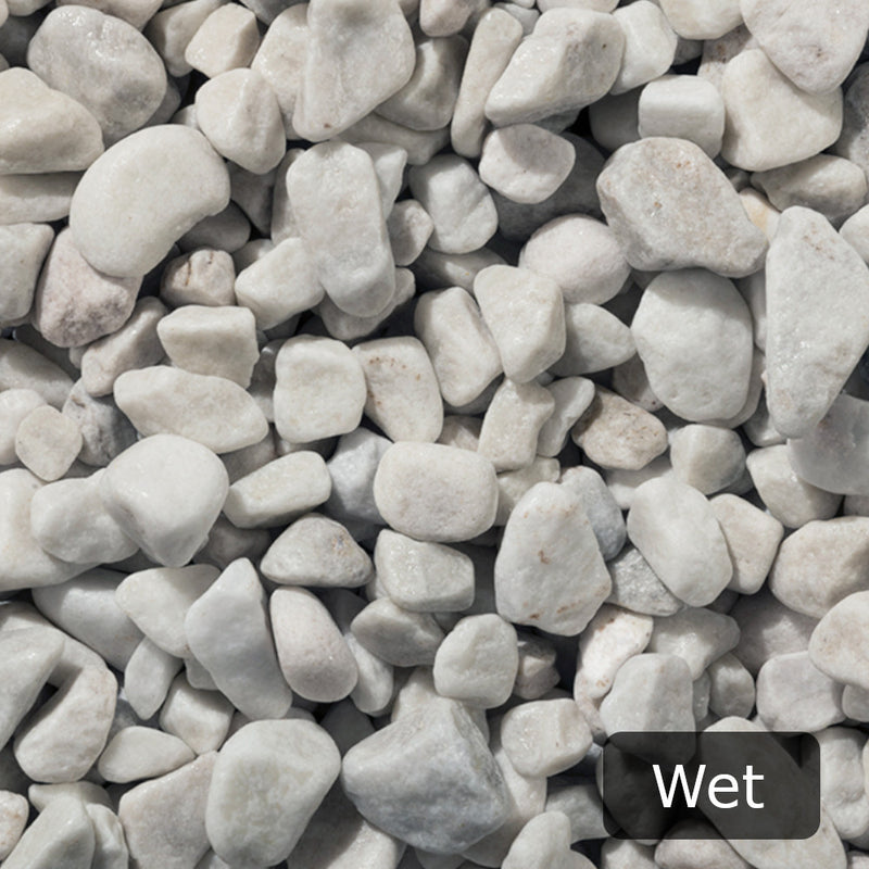 An aggregate image of Polar White Pebble stones when wet
