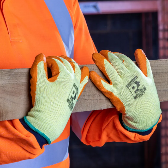 An image of Predator Latex Coated Gloves holding a wooden beam to show how robust they are. The latex is orange and the material is yellow.