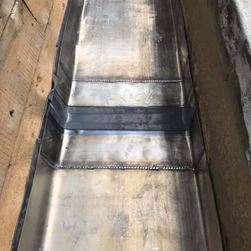 An image of Premium Lead expansion joints with a Black flexible middle being used on a roof