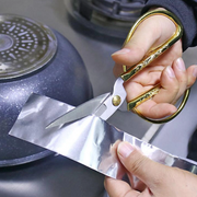 An image of Prosolve Aluminium Foil Tape being cut with scissors to show is can be easily trimmed to size.