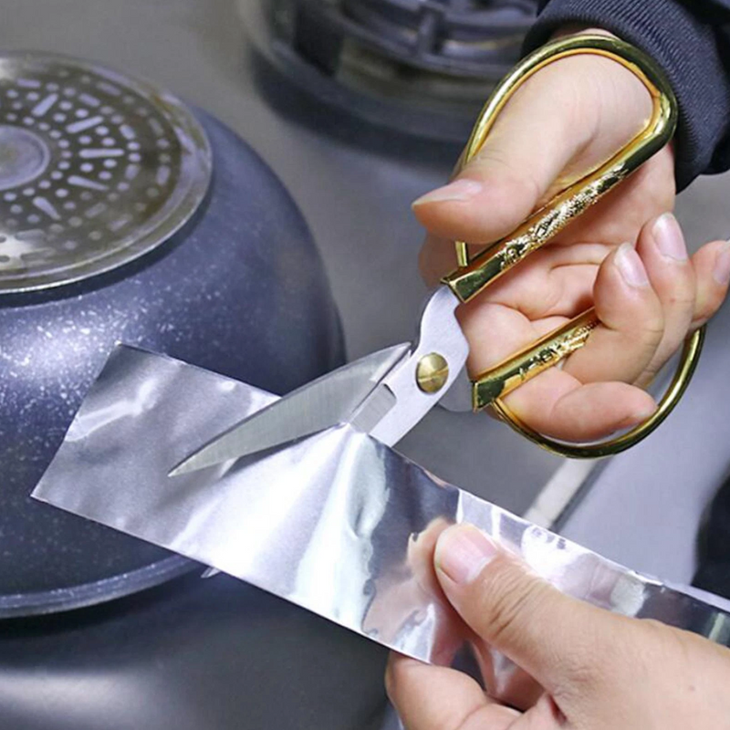 An image of Prosolve Aluminium Foil Tape being cut with scissors to show is can be easily trimmed to size.