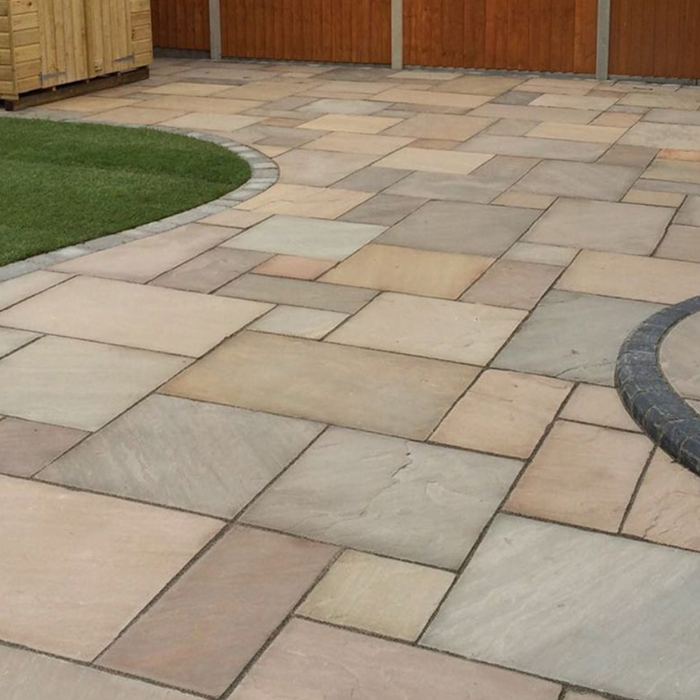 An image of Raj Green Indian Standstone Paving laid out to show what it looks like.