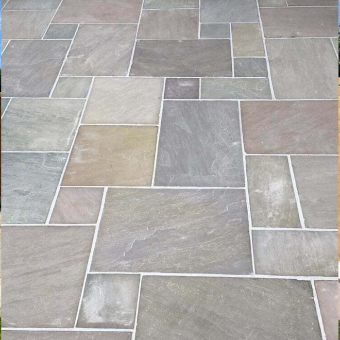 An image of Raj Green Indian Standstone Paving laid out to show what it looks like.