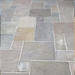 An image of Raj Green Indian Standstone Paving laid out to show what it looks like.