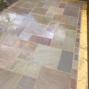 An image of Raj Green Indian Standstone Paving laid out to show what it looks like.