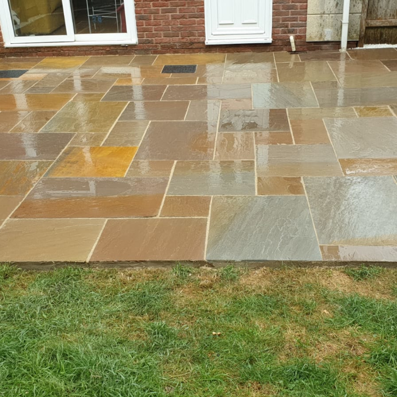 An image of Raj Green Indian Standstone Paving laid out to show what it looks like.