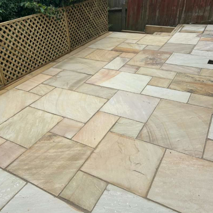 An image of Raj Green Indian Standstone Paving laid out to show what it looks like.