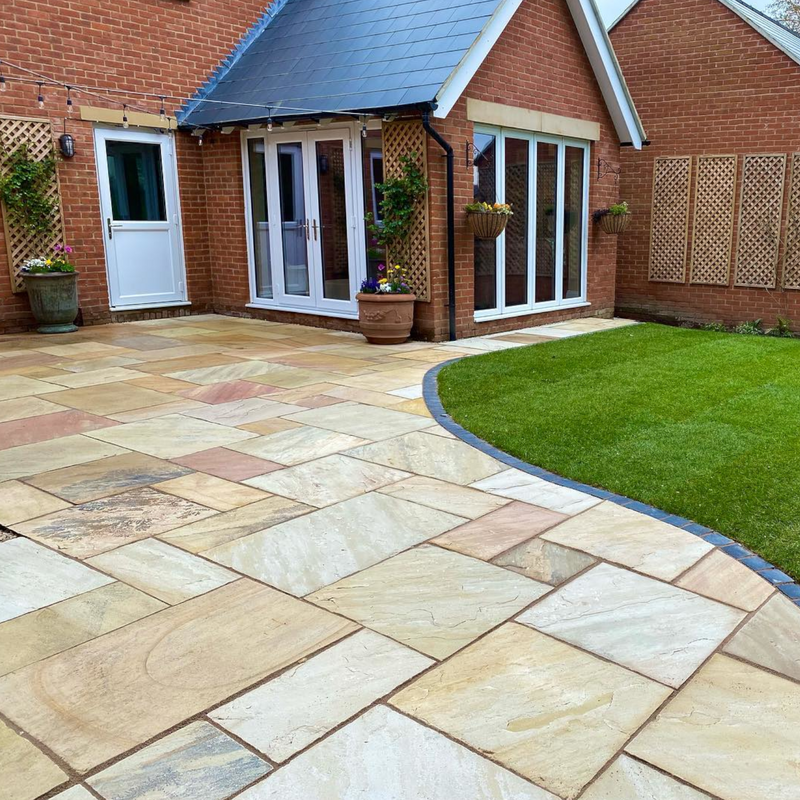 An image of Raj Green Indian Standstone Paving laid out to show what it looks like.