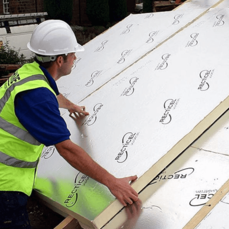 An image of a workman in a hardhat and high viz fitting Recticel Eurothan General Purpose PIR Insulation Board