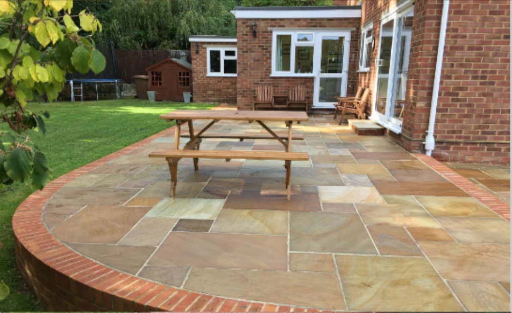 An image of a patio after using Resiblock Indian Sandstone Sealer, Colour Enhancer in a 5L.