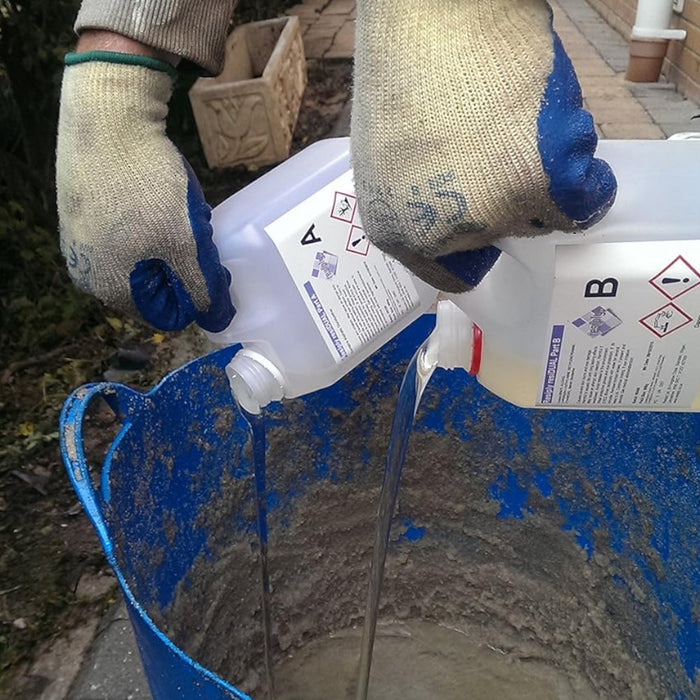 An image of Resiply resiDUAL Part A and B being poured into a sand mixture ready to brush into paving joints.