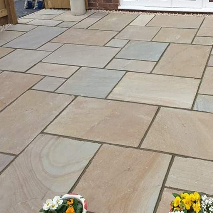 Am image of Rippon Buff Indian Sandstone Paving laid out to show how it looks.