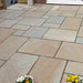 Am image of Rippon Buff Indian Sandstone Paving laid out to show how it looks.