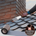 An image of the base of a chimney stack with Rose Roofing Self Adhesive Flashing Tape being applied to seal the join between the tiles and brick.