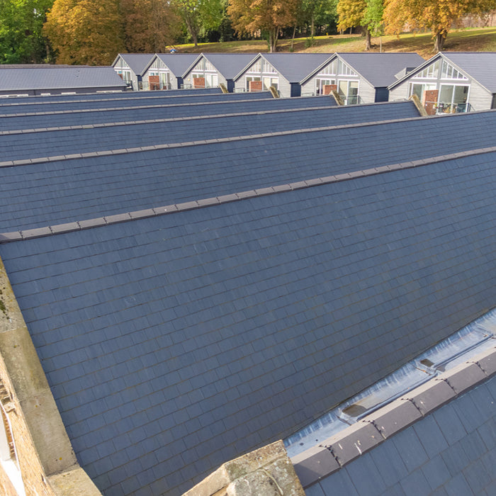 An image of a row of houses with SSQ Del Prado Spanish Slates on the roof to show what it would look like.