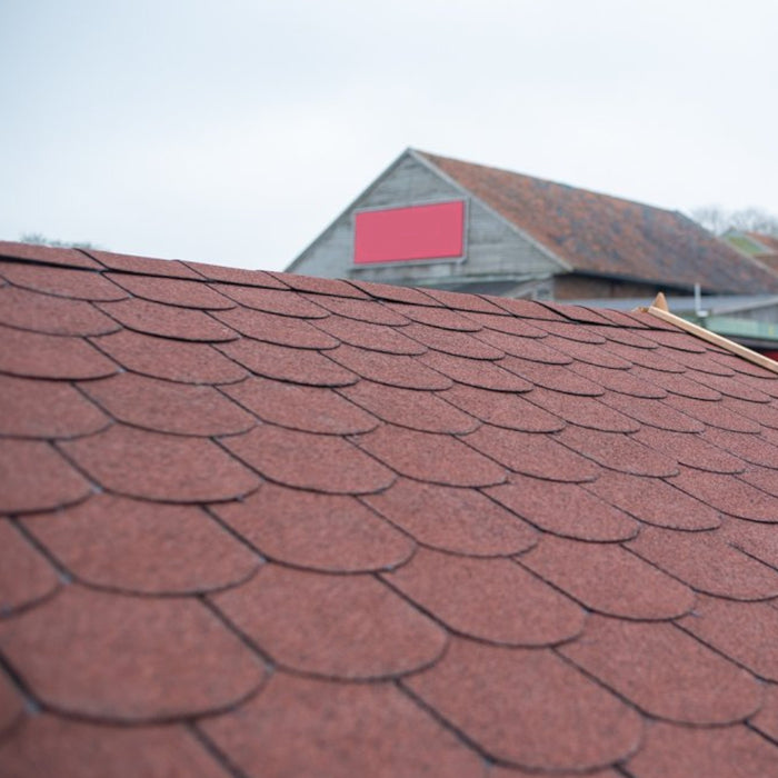 An image of a shed roof hat has been fitted with Fishscale felt Shingles in Antique Red.