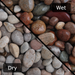 An image of a patio with Scottish Pebbles, 20-40mm-20kg. The image is diagonally cut to show what they look like when wet and dry.