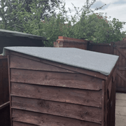An image of a roll of Black Rose Roofing Shed Felt fitted and installed onto a shed roof.