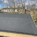 An image of a roll of Black Rose Roofing Shed Felt fitted and installed onto a shed roof.