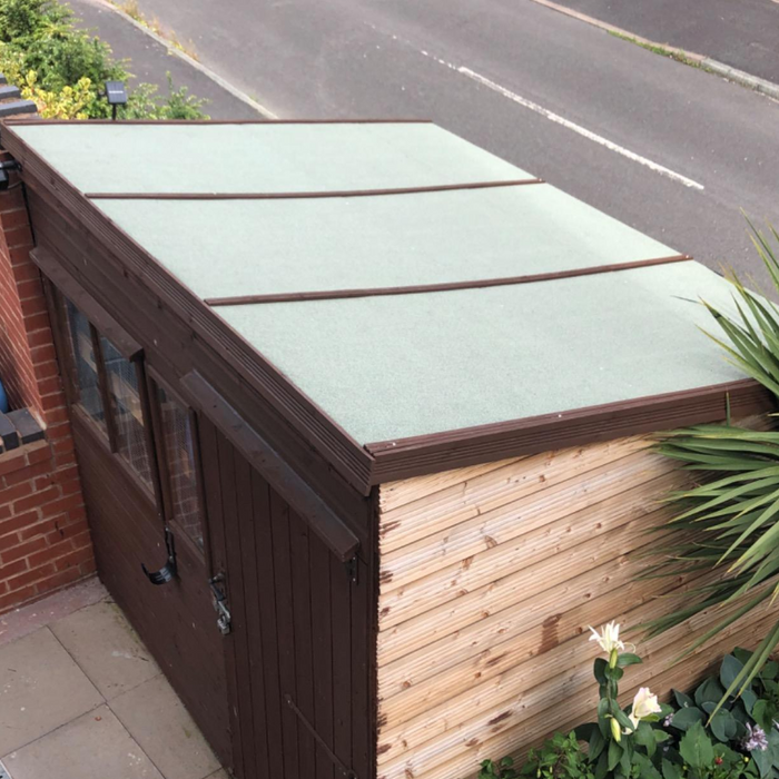 An image of a roll of Green Rose Roofing Shed Felt fitted and installed onto a shed roof.