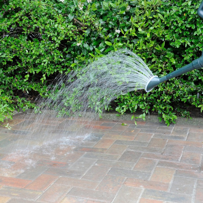 An image of Sika Setting sand and an example of what it looks like once it is swept into the gaps and then finishing it off with gentle wetting it