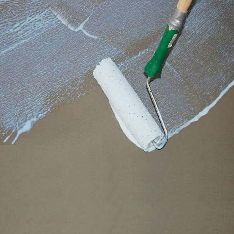 An image of SikaBond SBR Waterproofer & Bonding Admixture being to a surface with a roller.