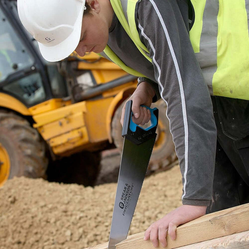 An image of a Spear and Jackson Predator First Fix Saw (PPI 7) being used to cut wood.