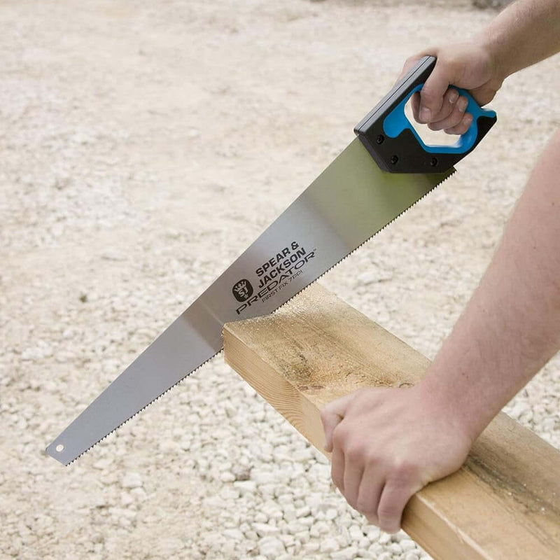 An image of a Spear and Jackson Predator First Fix Saw (PPI 7) being used to cut wood.