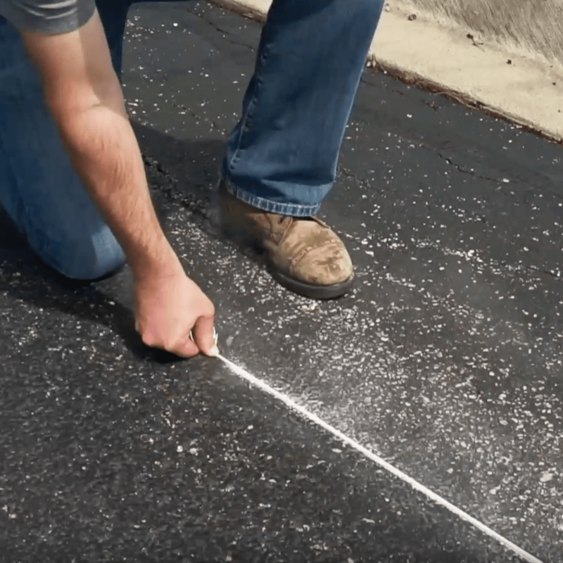 An image showing the Stanley Chalk Line in white on roofing felt