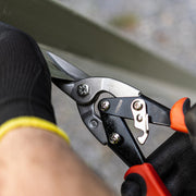 An image of straight cut TIMCO aviation snipping scissors cutting a thin piece of metal.