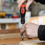 An image showing a TIMCO Philips screwdriver being used to drive a screw into wood.