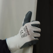 An image of TIMCO Secure Grip Gloves being used to grip and move a smooth surface without slipping.
