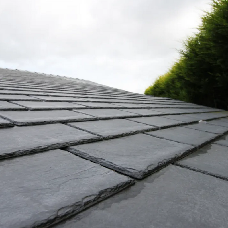 A roof with Tapco Classic Synthetic Roof Slate in Pewter Grey fitted to show what they look like