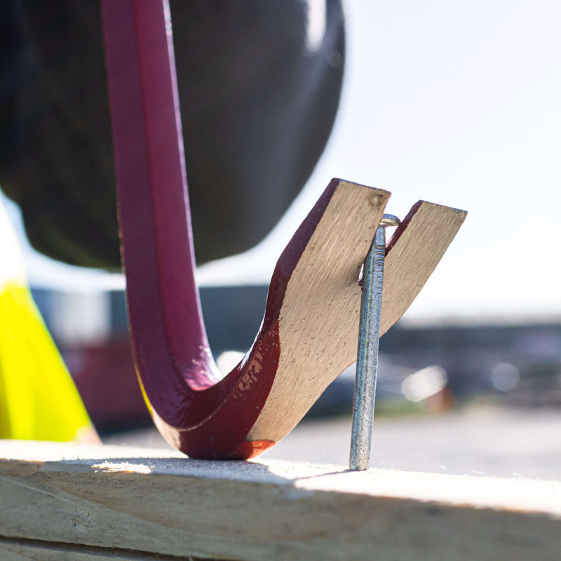 An image of a Timco Wrecking Bar / Crowbar being used to remove a nail from wood.