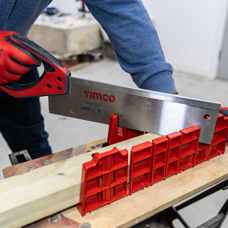 An image of Timco Clamping Mitre Box being used to cut a piece of wood at an angle.