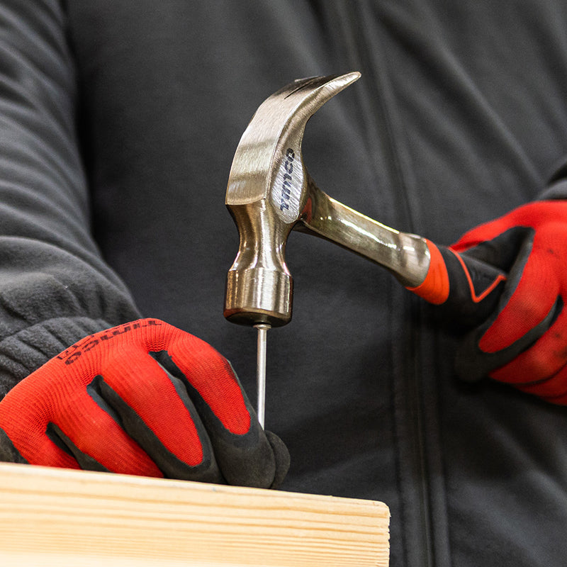An image of a 16oz Claw hammer from  Timco being used to drive in a nail.