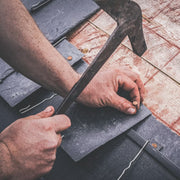 An image of Timco Copper Clout Nails being used to install roofing slate.