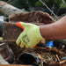 An image of Timco Eco Gloves Latex Crinkle being used to move stone to show how hard wearing and versatile they are.