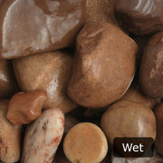 An image showing Tweed Cobble Stone Aggregate Gravel when they are wet.
