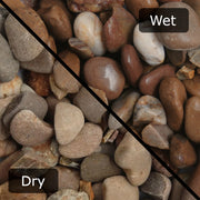 An image showing Tweed Pebble Stone Aggregate Gravel. The image is split horizontally to sow the difference between wet and dry.