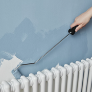 An image showing an Ultra Long-Roller Arm that is 100mm / 4in being used behind a radiator