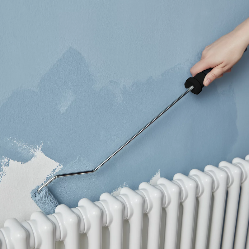 An image showing an Ultra Long-Roller Arm that is 100mm / 4in being used behind a radiator