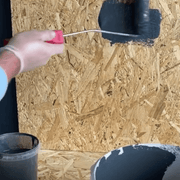 An image of Ultraflex Tixal Polyometric Thickener being applied to wood with a roller.
